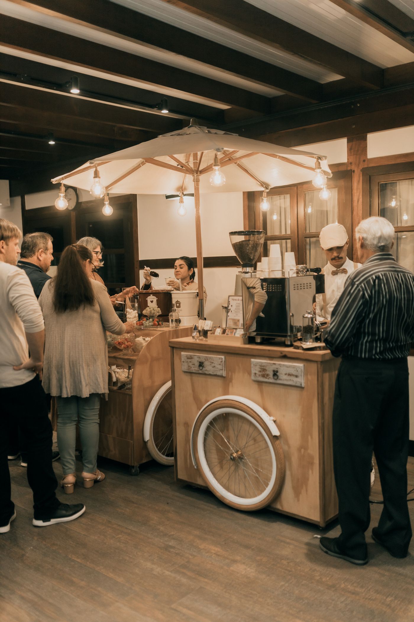The cart pouring drinks at a private indoor gathering