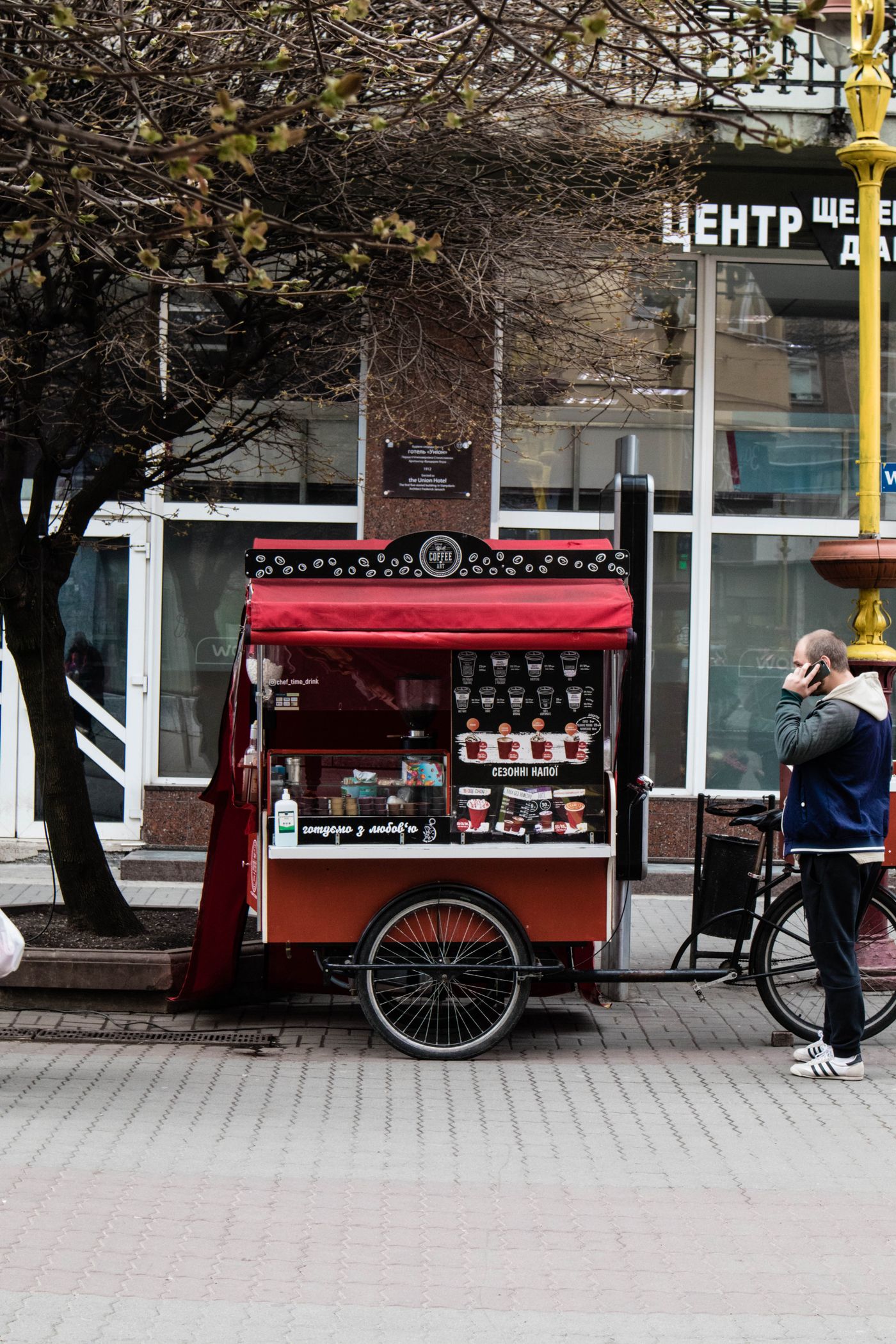 A red coffee cart on a city street